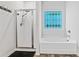 Bright bathroom with tub, separate shower, and decorative privacy window at 218 Piedmont Cir, Canton, GA 30114