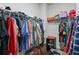 Walk-in closet with ample storage space, shelving and hanging rods at 218 Piedmont Cir, Canton, GA 30114