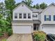 Charming two-story townhome featuring a two-car garage and well-maintained landscaping at 218 Piedmont Cir, Canton, GA 30114