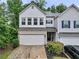 Charming two-story townhome featuring a two-car garage and well-maintained landscaping at 218 Piedmont Cir, Canton, GA 30114