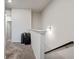 Upstairs hallway with carpet, railing, neutral paint, and natural light at 218 Piedmont Cir, Canton, GA 30114