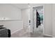 Upstairs hallway with carpet, leading to bedrooms and a view of the laundry area at 218 Piedmont Cir, Canton, GA 30114