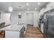 Charming kitchen featuring granite counters, stainless appliances, and stylish pendant lighting at 218 Piedmont Cir, Canton, GA 30114