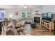 Comfortable living area featuring a cozy sectional sofa, fireplace, and natural light at 218 Piedmont Cir, Canton, GA 30114