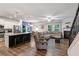 Bright open floor plan with a modern kitchen island, fireplace, and cozy living area at 218 Piedmont Cir, Canton, GA 30114