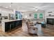 Bright open floor plan with a modern kitchen island, fireplace, and cozy living area at 218 Piedmont Cir, Canton, GA 30114