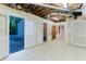 Unfinished basement area with open ceilings, open doors, and exterior views at 2552 Berwick Walk, Snellville, GA 30078