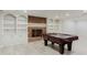 Large basement rec room with fireplace, built-in bookcases and space for recreation at 2552 Berwick Walk, Snellville, GA 30078