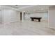 Open basement area featuring a pool table, plenty of storage, and access to natural light at 2552 Berwick Walk, Snellville, GA 30078