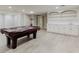 Finished basement featuring a pool table, cabinets, and a sink area at 2552 Berwick Walk, Snellville, GA 30078