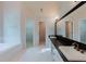 Bathroom with tub, double sinks, and large mirror at 2552 Berwick Walk, Snellville, GA 30078