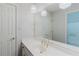 Bright bathroom featuring an extended vanity, modern lighting fixtures, and a large mirror at 2552 Berwick Walk, Snellville, GA 30078
