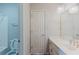 Cozy bathroom featuring a sink with a large mirror, and shower-tub combination at 2552 Berwick Walk, Snellville, GA 30078
