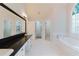 Bathroom with a bathtub, shower, and large vanity counter at 2552 Berwick Walk, Snellville, GA 30078