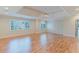 Bright bedroom showcasing hardwood floors, tray ceilings, and expansive windows, enhancing its spacious feel at 2552 Berwick Walk, Snellville, GA 30078