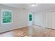Bedroom with hardwood floors, white walls, closet, and a window with natural light at 2552 Berwick Walk, Snellville, GA 30078