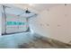 Empty garage featuring a white door with windows, unfinished walls, and concrete floors at 2552 Berwick Walk, Snellville, GA 30078