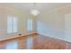 Elegant living room showcasing detailed molding, bright windows and hardwood floors at 2552 Berwick Walk, Snellville, GA 30078