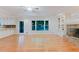 Open living area with hardwood floors and combined kitchen and living spaces at 2552 Berwick Walk, Snellville, GA 30078