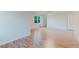 Spacious living room featuring hardwood floors, white walls, and a window with natural light at 2552 Berwick Walk, Snellville, GA 30078