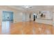 Bright open floor plan with hardwood flooring connecting the living area and kitchen at 2552 Berwick Walk, Snellville, GA 30078