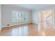 Living room boasting hardwood floors, bright windows, and elegant trim at 2552 Berwick Walk, Snellville, GA 30078