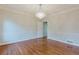 Charming living room showcasing detailed molding, bright lighting and hardwood floors at 2552 Berwick Walk, Snellville, GA 30078