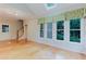 Inviting living room boasts hardwood floors, large windows, and a staircase at 2552 Berwick Walk, Snellville, GA 30078