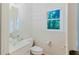 Bright powder room features a unique glass vessel sink and neutral decor at 2552 Berwick Walk, Snellville, GA 30078