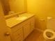 Bathroom with vanity, sink, tile floors, and toilet at 2845 Woodhollow Ln, Jonesboro, GA 30236
