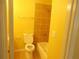 Bathroom featuring tile walls, bathtub, and showerhead at 2845 Woodhollow Ln, Jonesboro, GA 30236