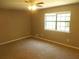 Bedroom featuring carpet flooring, a ceiling fan, and a window at 2845 Woodhollow Ln, Jonesboro, GA 30236