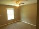 Bedroom featuring carpet flooring, a ceiling fan, and a window at 2845 Woodhollow Ln, Jonesboro, GA 30236