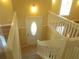 Inviting entryway featuring a staircase with white railings and a decorative front door at 2845 Woodhollow Ln, Jonesboro, GA 30236