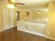 Upper hallway features white railings, and views to several bedrooms at 2845 Woodhollow Ln, Jonesboro, GA 30236