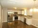 Modern kitchen with stainless steel appliances, white cabinets, and updated countertops at 2845 Woodhollow Ln, Jonesboro, GA 30236