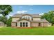 Expansive backyard showcasing a lush lawn and the home's exterior, ideal for outdoor living and entertaining at 3700 Terrasol Sw Trl, Lilburn, GA 30047