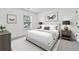 Modern bedroom with white walls, minimalist decor, and natural light, offering a serene and peaceful retreat at 3700 Terrasol Sw Trl, Lilburn, GA 30047