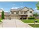 Attractive two-story home with a three-car garage, well-manicured lawn, and a basketball hoop in the driveway at 3700 Terrasol Sw Trl, Lilburn, GA 30047