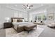 Spacious main bedroom with tray ceiling, sitting area, and large windows at 3700 Terrasol Sw Trl, Lilburn, GA 30047