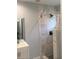 Modern bathroom featuring an updated shower with marble tile surround and vanity with sink at 4324 Rocklane Dr, Conley, GA 30288