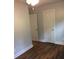 Bedroom with hardwood floors and two closets at 4324 Rocklane Dr, Conley, GA 30288