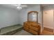 Bedroom features hardwood floors, a dresser, and a comfortable sleeping arrangement at 4324 Rocklane Dr, Conley, GA 30288