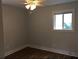 Bedroom featuring wood floors, neutral walls, and a window at 4324 Rocklane Dr, Conley, GA 30288