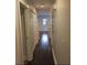 Hallway with hardwood floors and access to multiple rooms at 4324 Rocklane Dr, Conley, GA 30288