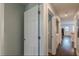 Inviting hallway with hardwood floors leading to various rooms in the house at 4324 Rocklane Dr, Conley, GA 30288