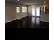 Spacious living room with hardwood floors, recessed lighting, and access to the exterior through a glass door at 4324 Rocklane Dr, Conley, GA 30288