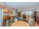 Open-concept living room featuring hardwood floors and views into the kitchen and dining area at 4324 Rocklane Dr, Conley, GA 30288