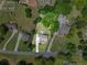 Aerial view of property with highlighted lot lines, showcasing the house and spacious outdoor space at 592 Hayes Rd, Auburn, GA 30011