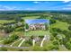 Aerial view showcasing a beautiful home nestled within a picturesque landscape with lush greenery at 592 Hayes Rd, Auburn, GA 30011